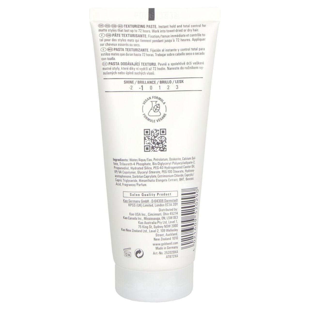 Male model showing textured hairstyle created with Goldwell Roughman Texturizing Paste demonstrating matte finish and strong hold