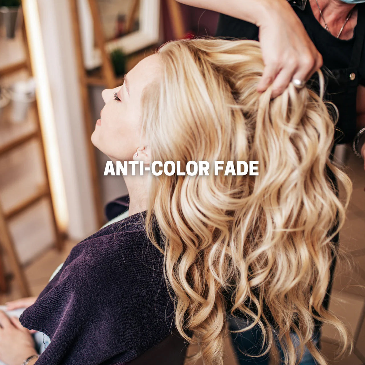 Agadir Argan Oil Volumising Hair Spray can next to argan nuts and oil, highlighting natural ingredients.
