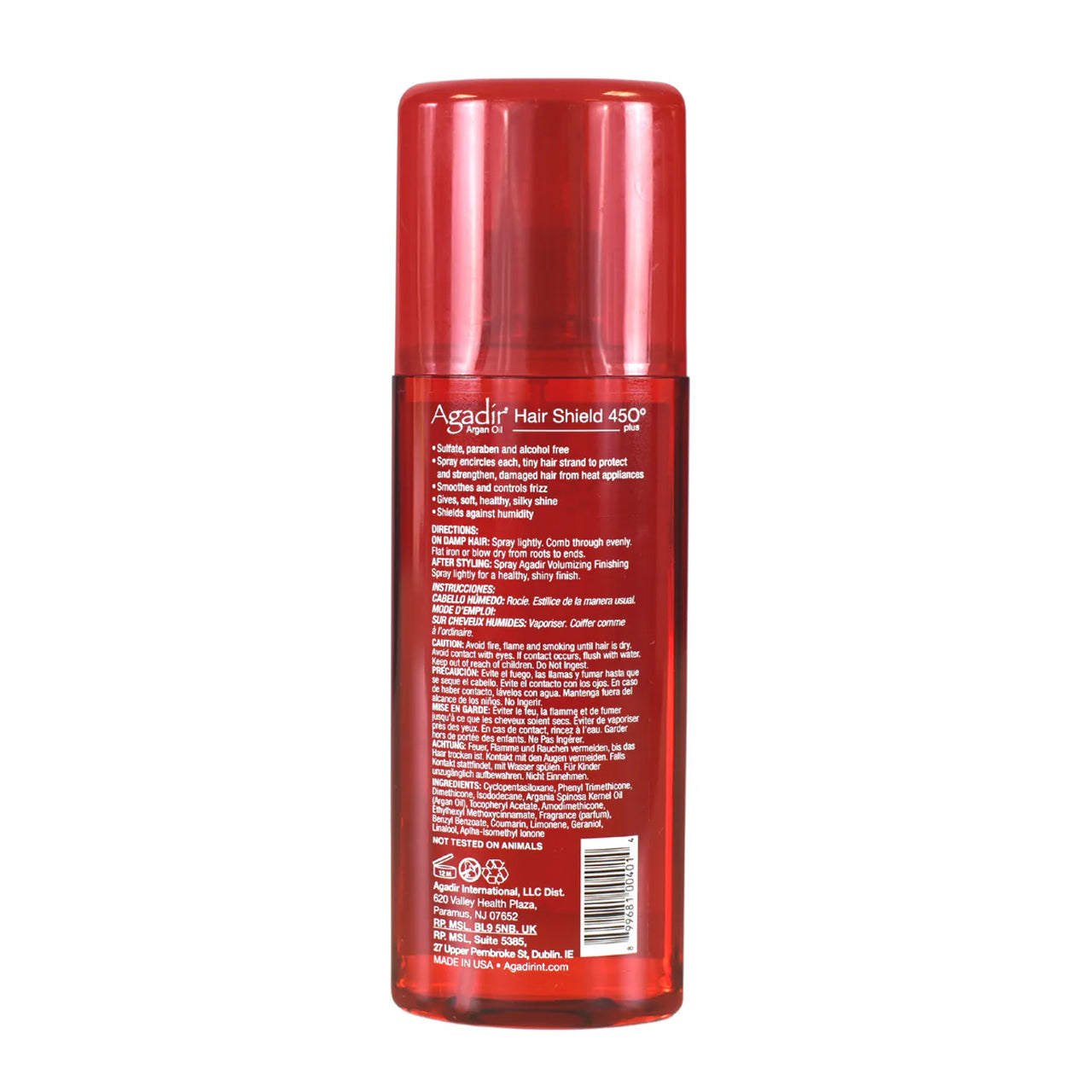 Agadir Hair Shield 450 Plus Spray bottle next to argan nuts and oil, highlighting natural ingredients.