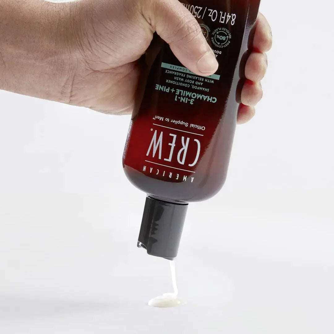 Close-up of American Crew 3-in-1 Shampoo with chamomile and pine extracts in 450ML size.