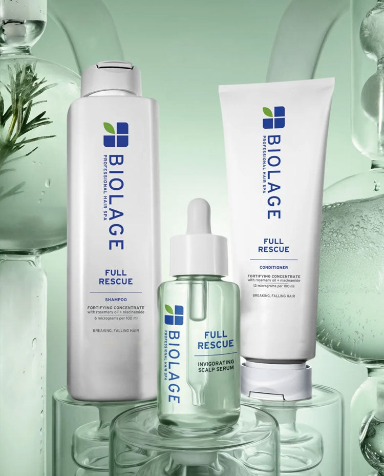 Biolage professional haircare collection featuring salon-quality shampoos, conditioners, and treatments in sleek white and green bottles against natural background