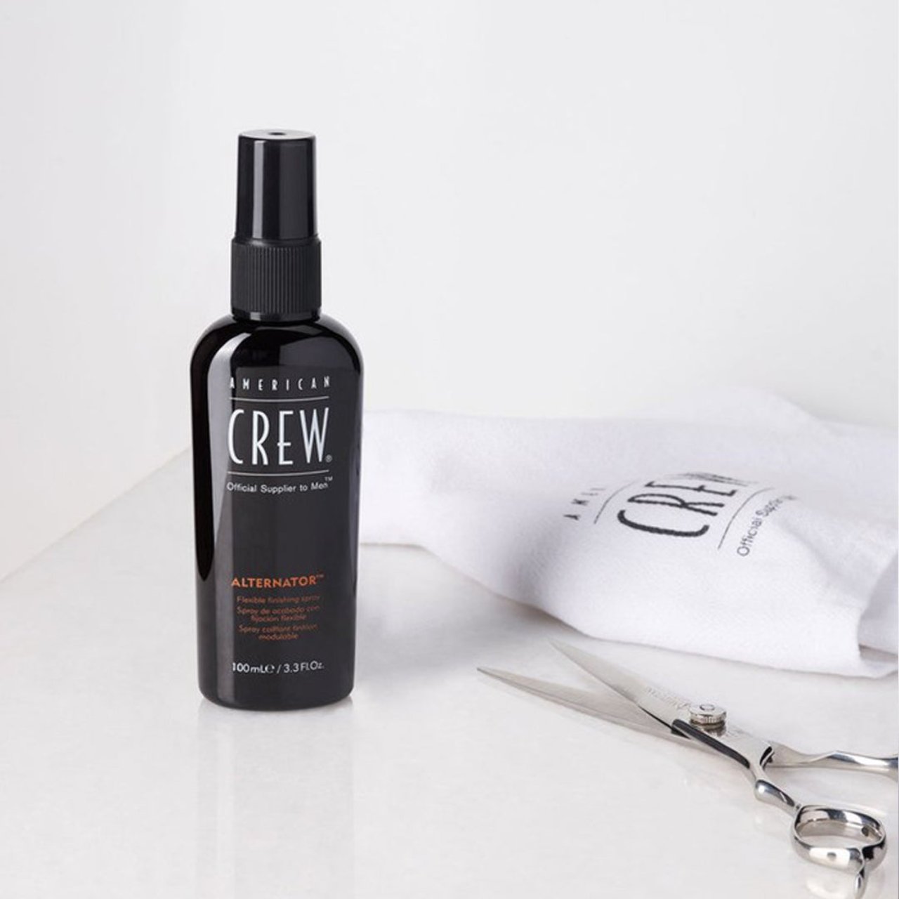 Close-up of American Crew Alternator Finishing Spray bottle