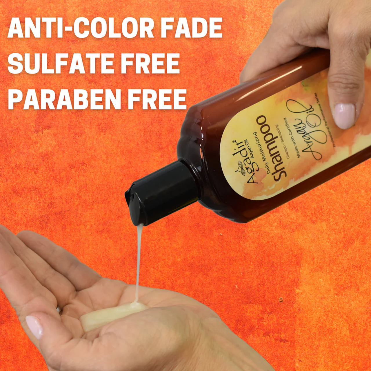 Close-up of the sulphate-free shampoo being poured from the bottle, showing its rich, creamy texture.