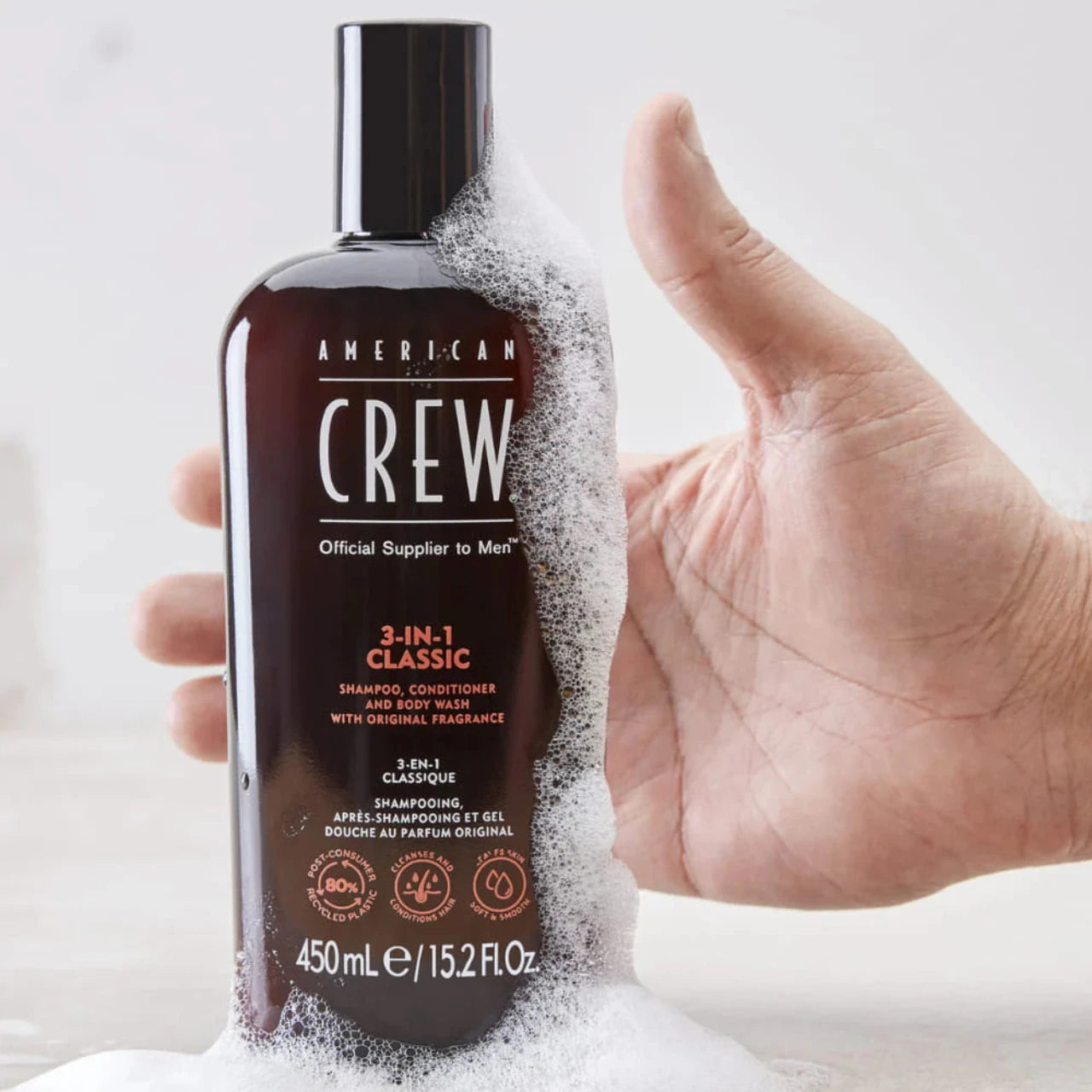 Close-up of American Crew Classic 3 In 1 450ml applied to clean, styled hair